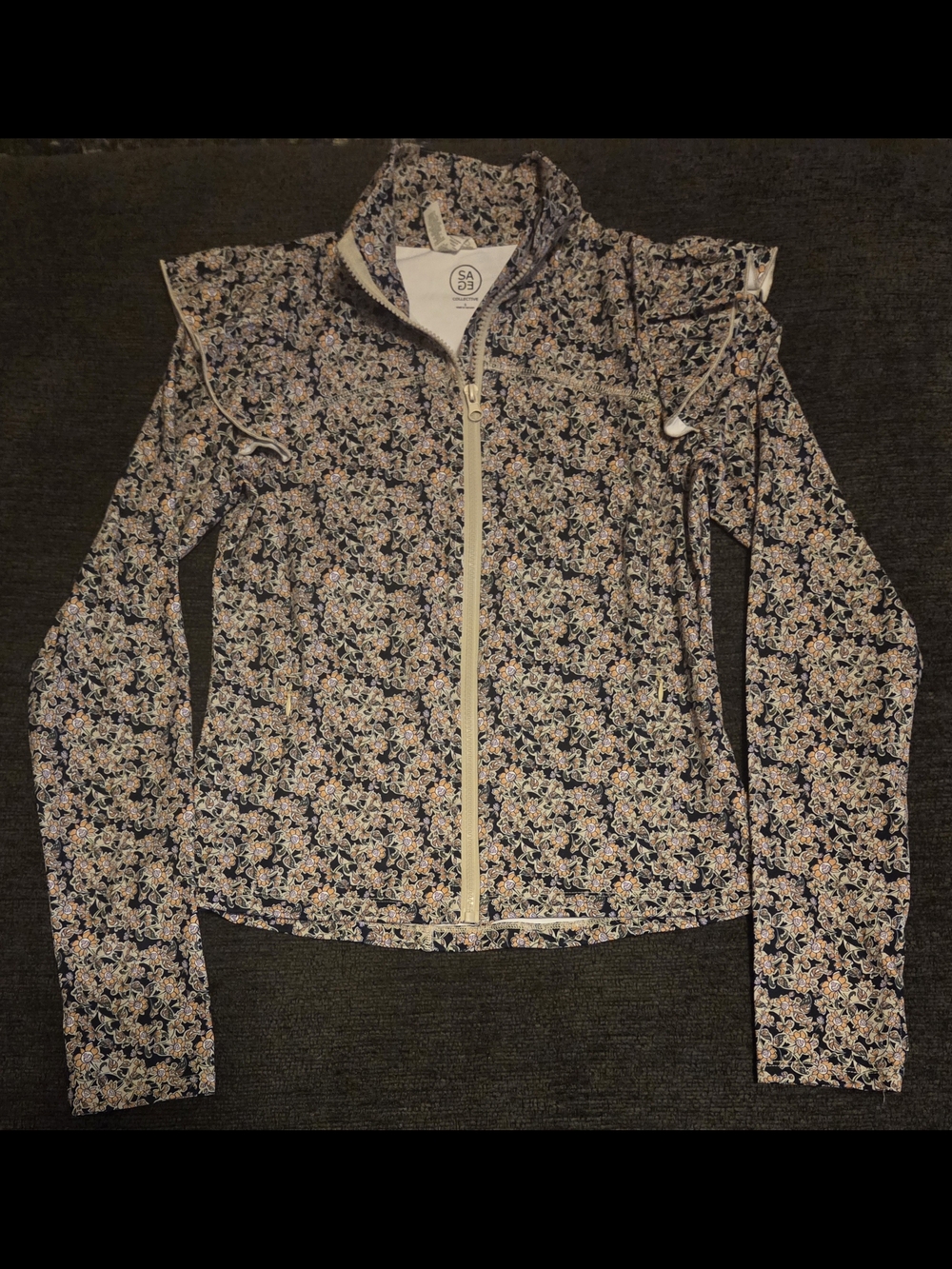 SAGE Collective Floral Zip Up Golf Jacket With Ruffle Shoulders. Size S